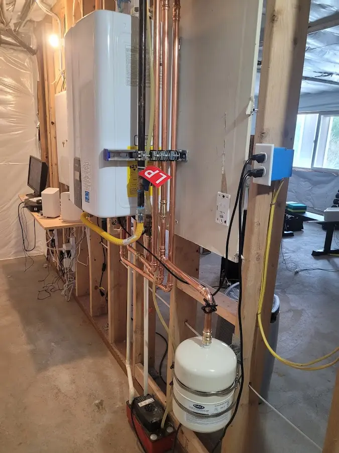 Licensed plumber repairing a kitchen sink in Stafford